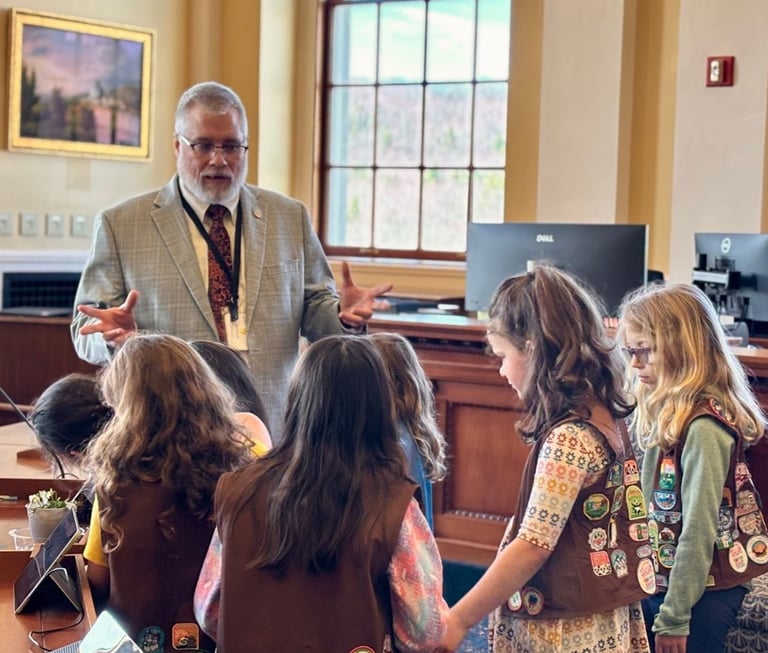 Tim at the Maine State House with visiting Girl Scout Brownies