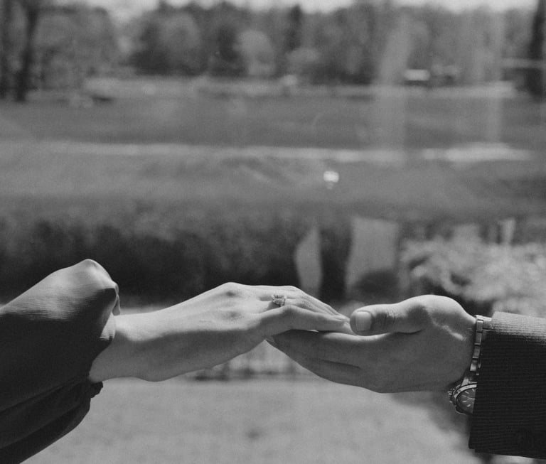 A man taking the hand of a woman