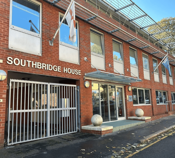 a building with a flag on it and a flag on the side of the building