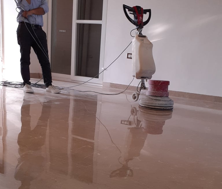 Polishing a marble floor for a high reflective shine to finish.