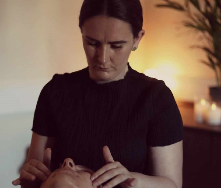 Emily Britten providing acne facial treatment for skin transformation client