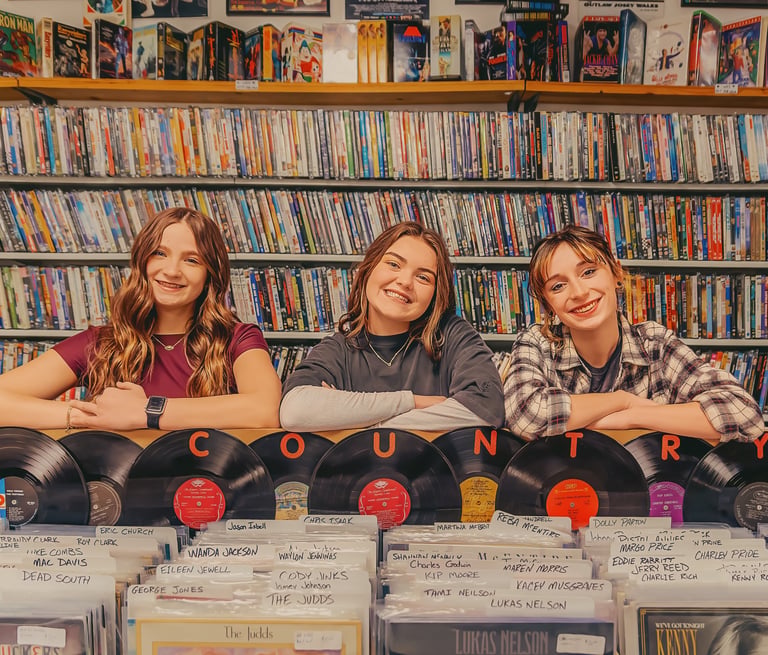 Senior pictures in a record store by Manheim PA senior picture photographer. Senior Rep Team Lancaster PA