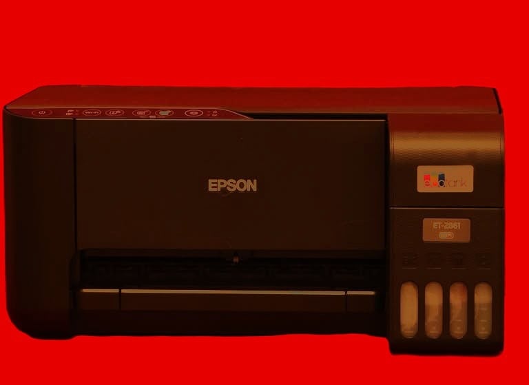 a printer printer with a red background and a black and white printer