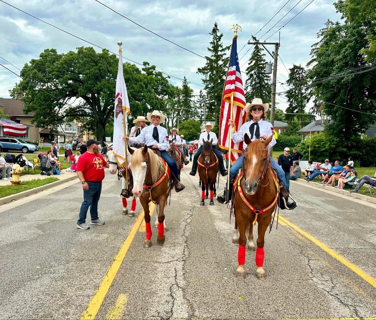 A group of people on horses during a parade,