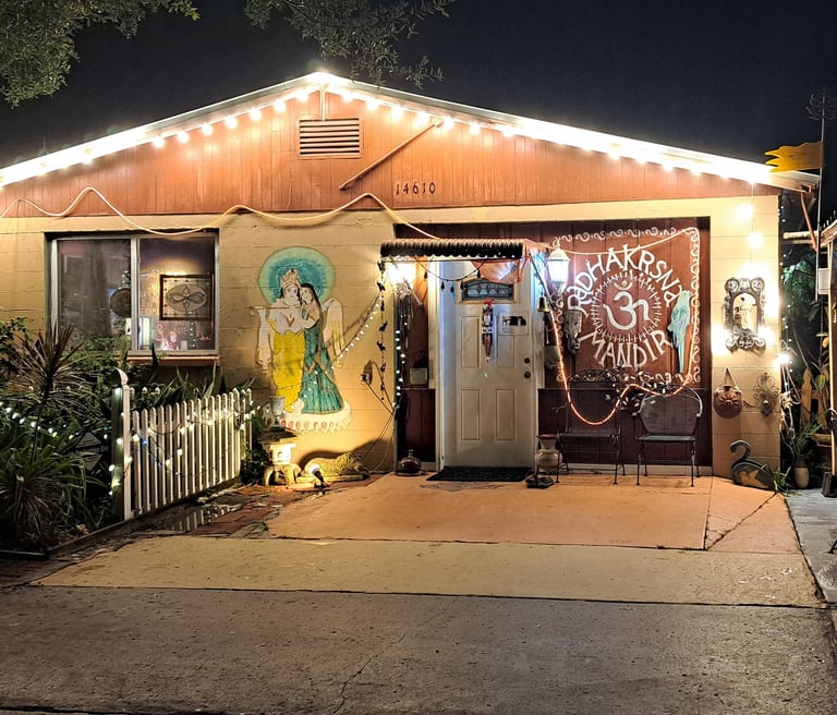 An evening photo of the exterior of the main sanctuary with Sri Sri Radha Vrndaban Chandra inside