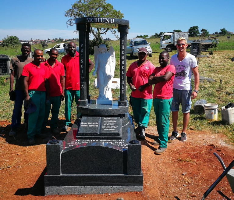 The Tegg's team with a custom memorial manufactured by TGM