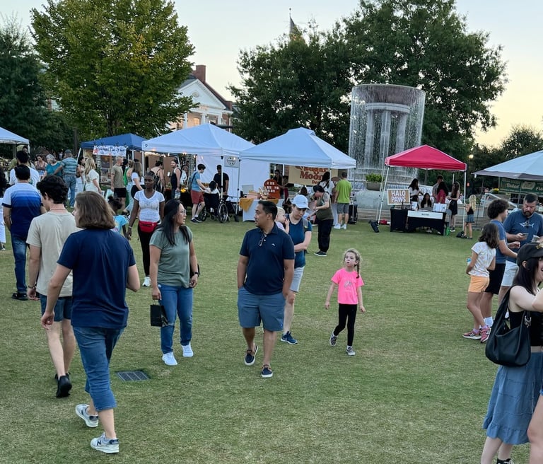 Families, kids, and community members enjoying nice weather at a market