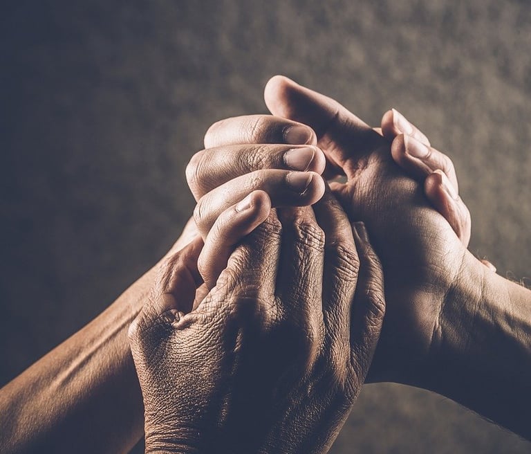 Multiple generations represented holding hands.
