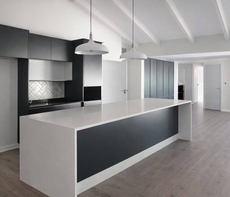 Modern minimalist kitchen with white quartz island, black cabinetry, and vaulted beamed ceilings.
