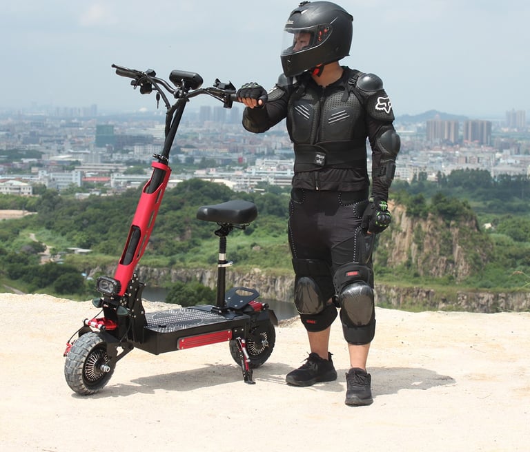 a man in a helmet and knee pads on a scooter
