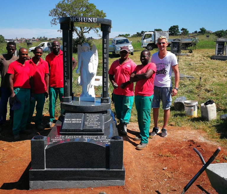 The Tegg's team with a custom memorial manufactured by TGM