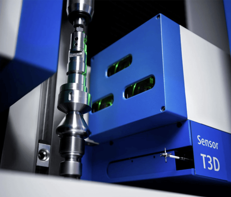 Precision turned part being inspected by optical shaft scanner and a scanning touch probe.