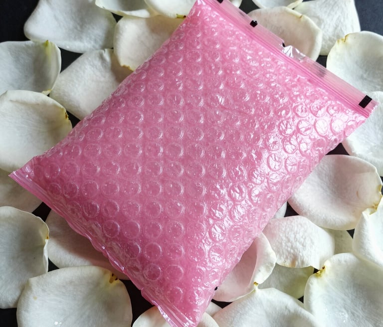 white plastic pack on purple and white floral textile