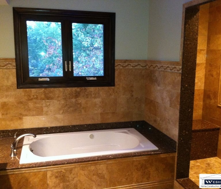 After tile installation, custom build shower, lighting update. Bathroom remodeled in Mount Prospect