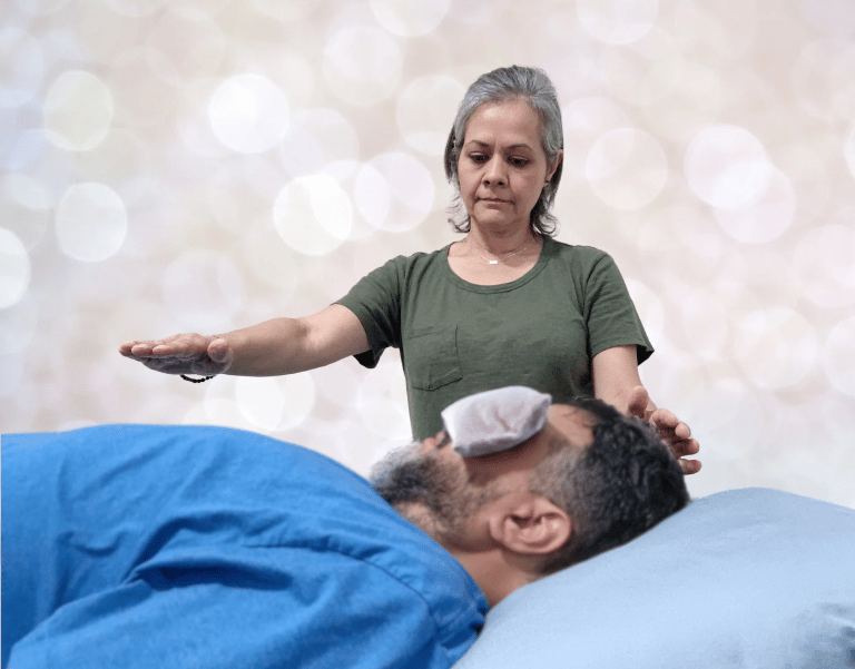 Reiki Master Teacher providing energy work