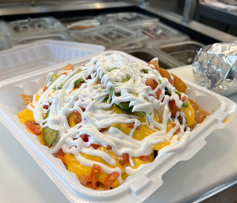Super Nachos of food that is sitting on a counter