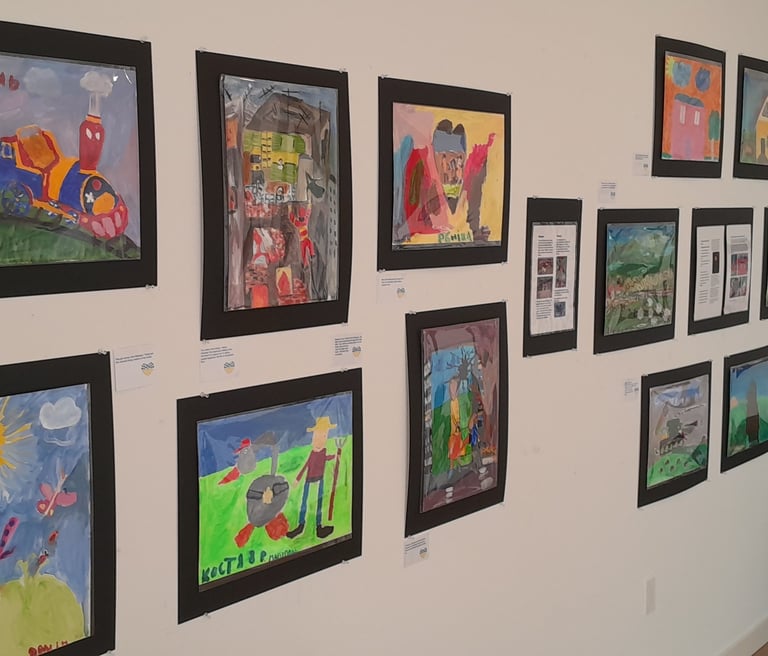 Display showing Ukrainian kids paintings in VALA