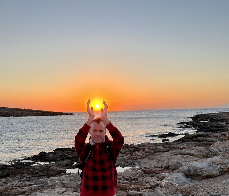 Man holds sun in hands above his head bringing forth the Light to illuminate the world