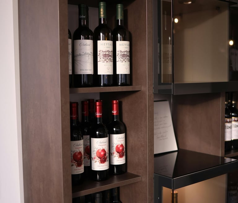 Modern luxury wine display with custom wood joinery and premium ambient lighting.