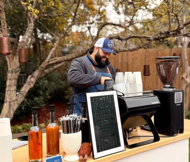 Friday Coffee Cart barista steaming milk for lattes at a corporate event