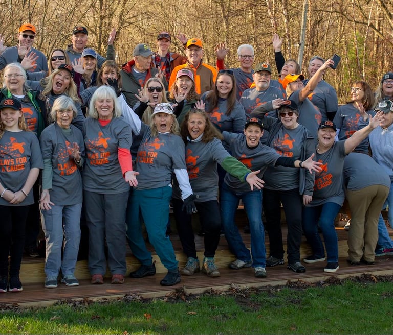 Photo of large group posing after a successful event.