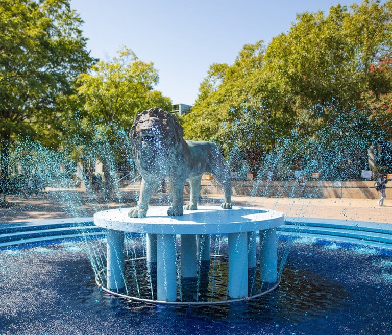 A statue of the Old Dominion Lion in a fountain