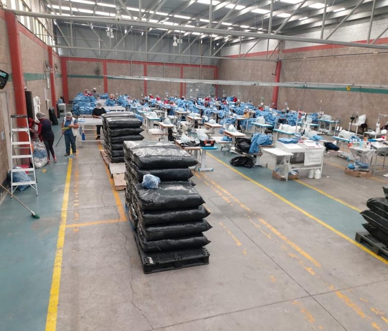 a large room with many emplyees making uniforms