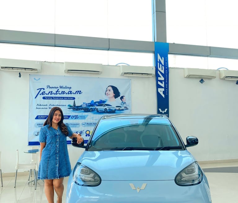 a woman standing in front of a car