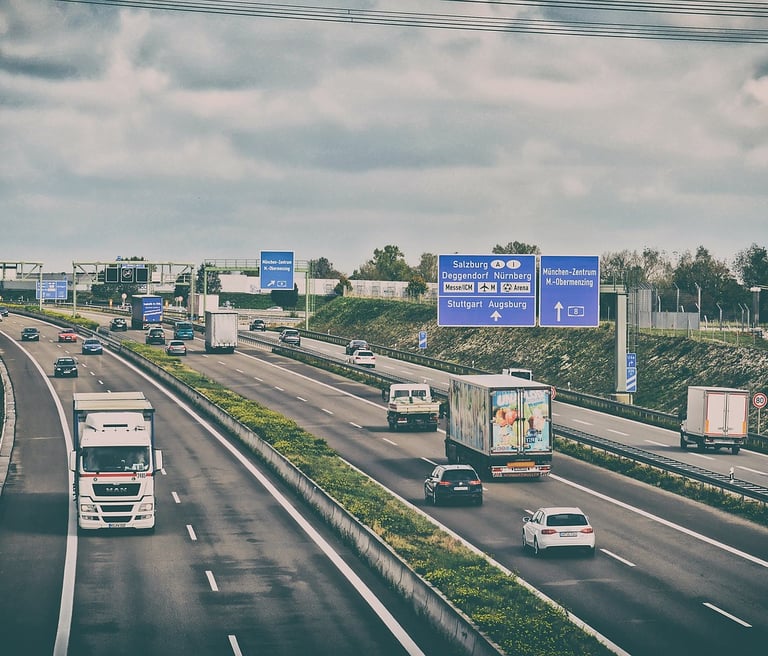 trucks and cars on a highway