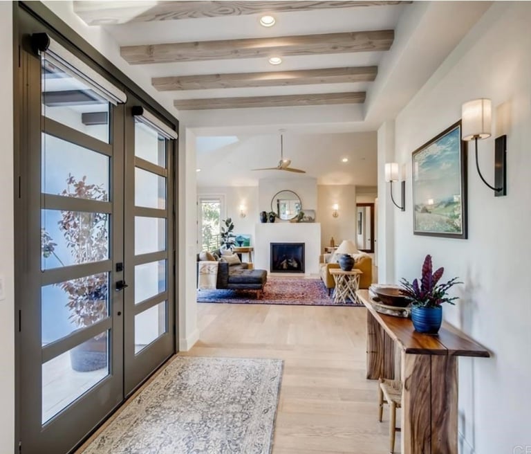 The grand entrance of a hacienda style house.