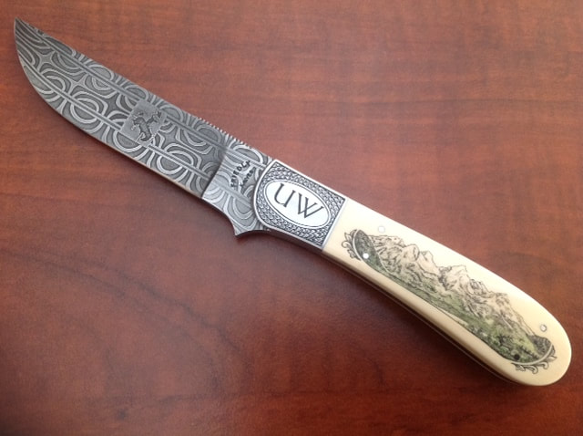 a custom engraved knife on a table