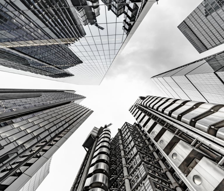 a cityscape of tall buildings with a sky view of the city