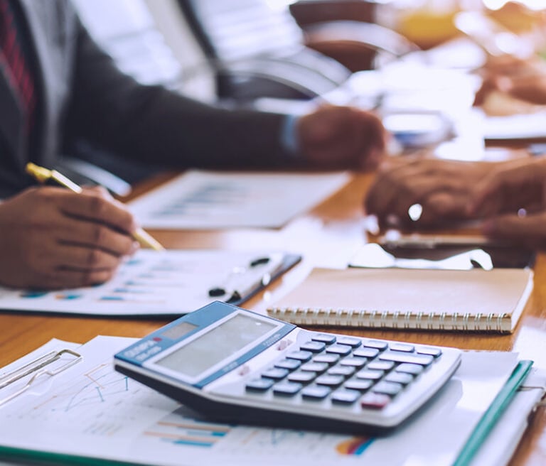 a group of people doing financial analysis