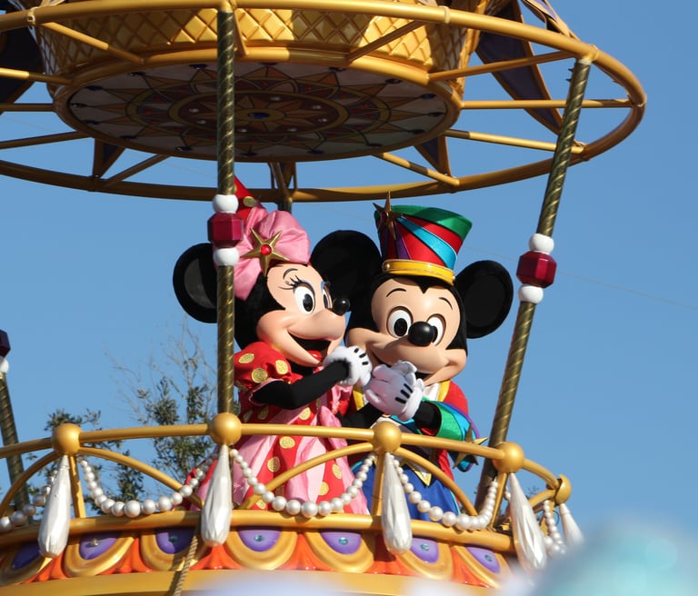a mickey mouse and minnie mouse float in a float
