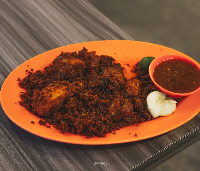 a plate of Ayam Goreng Bumbu at Johny Kopitiam Batam