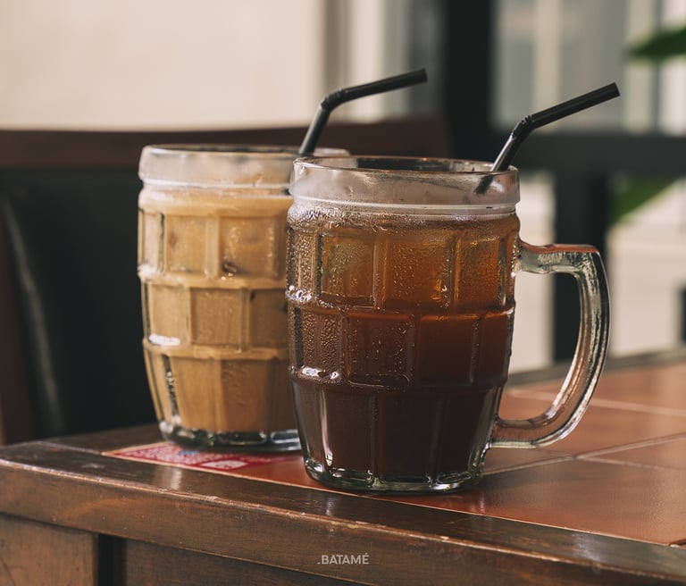 a cup of Ice Tea Asam Jawa and Ice Coffee at NUUD Batam