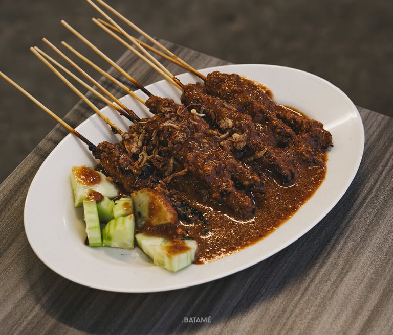 a plate of chicken satay at Johny Kopitiam Batam