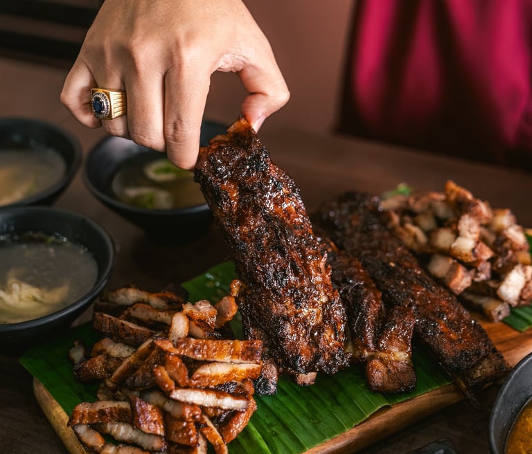 a platter of meat and Iga Bakar at BPK Chika Batam