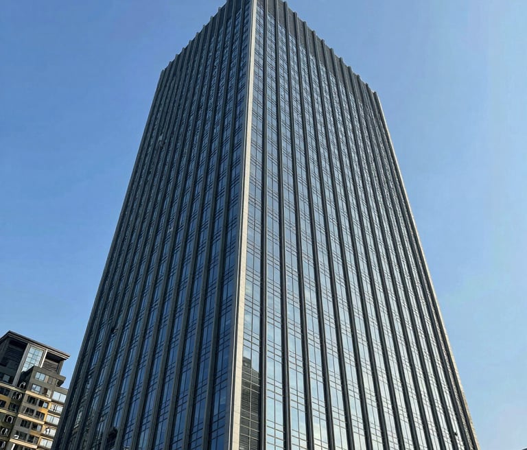 A sleek, modern office space bathed in calming light blue hues, with digital screens displaying futuristic technology concepts.