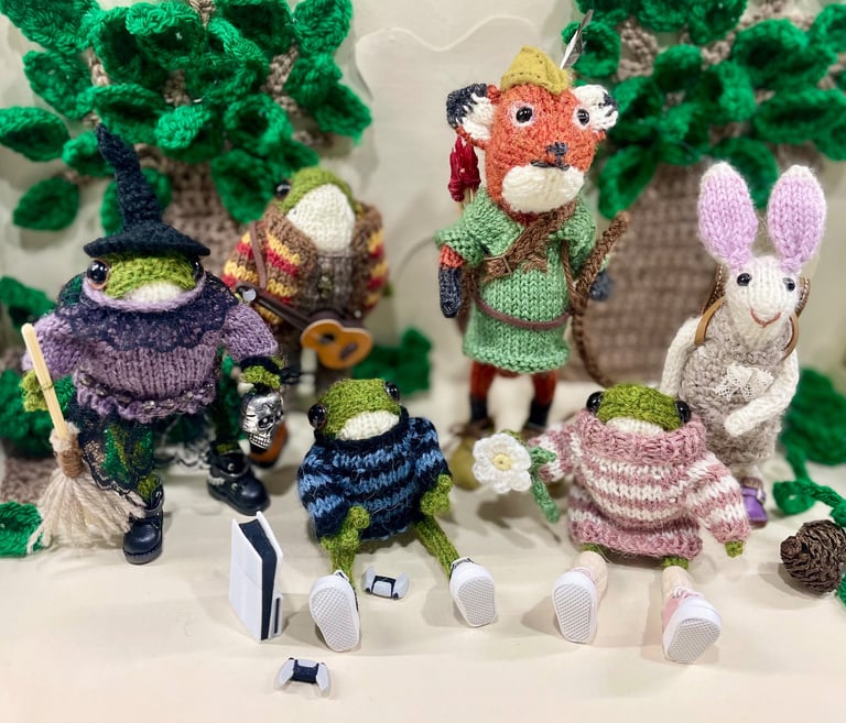 a group of knitted little animal ornaments