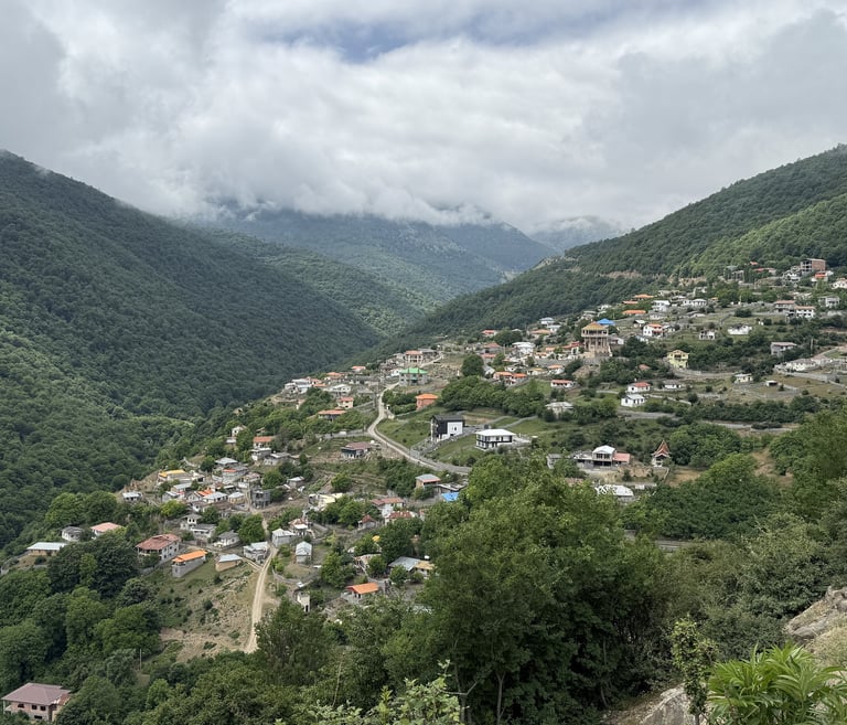 Mountain village of Kalej in Mazandaran, Iran, green valley with houses.