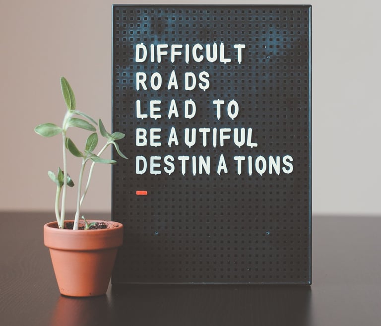 Sign saying Difficult Roads Lead To Beautiful Destinations