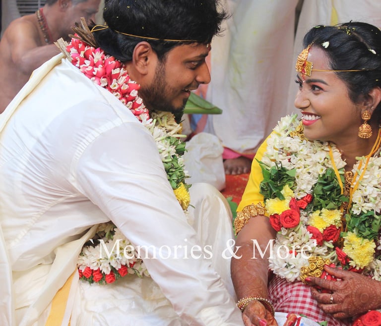 a man and woman in traditional indian wedding attire