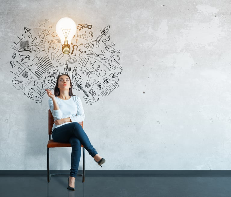 A woman sitting in a chair with a light bulb above her head, representing a brilliant idea.