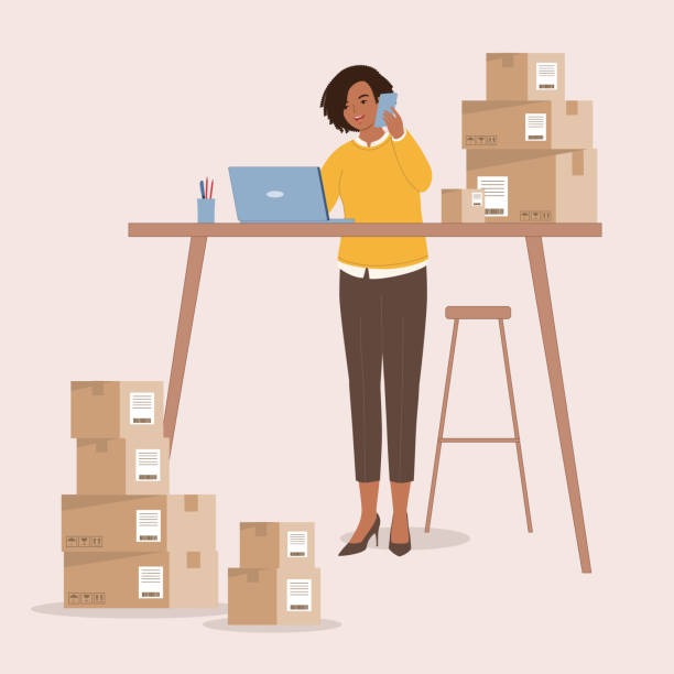 Female entrepreneur managing e-commerce shipping and orders with laptop and boxes.