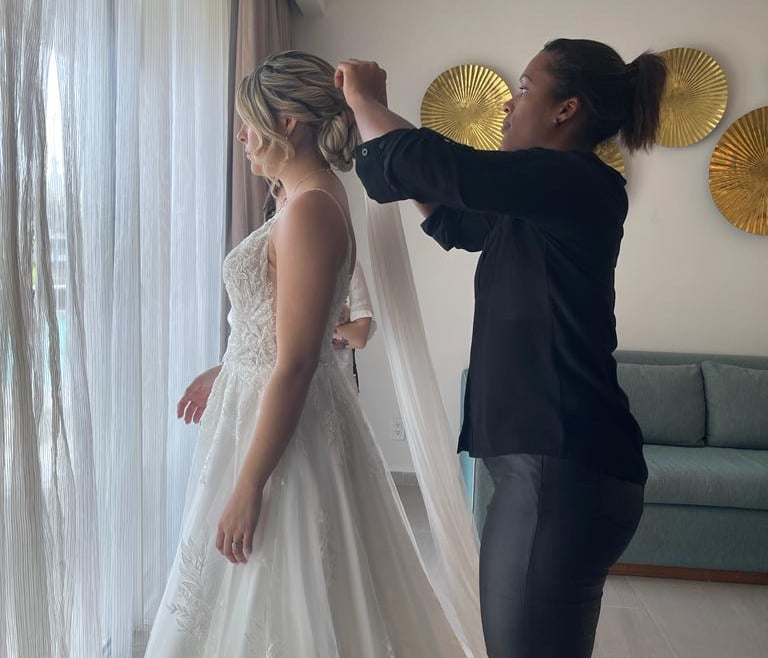 Deya Ventura preparing a bride for her wedding day with bridal hair and makeup in Punta Cana