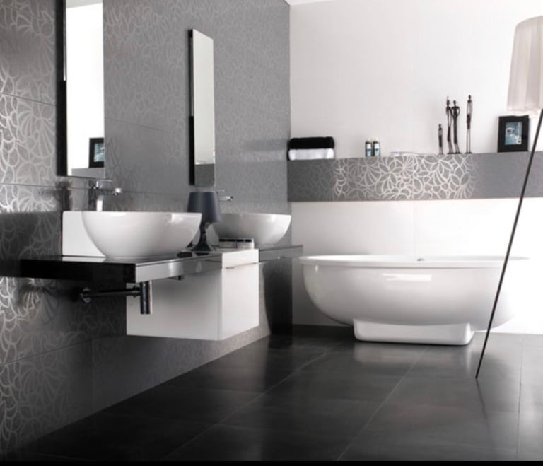 a bathroom with a white sink and a large mirror