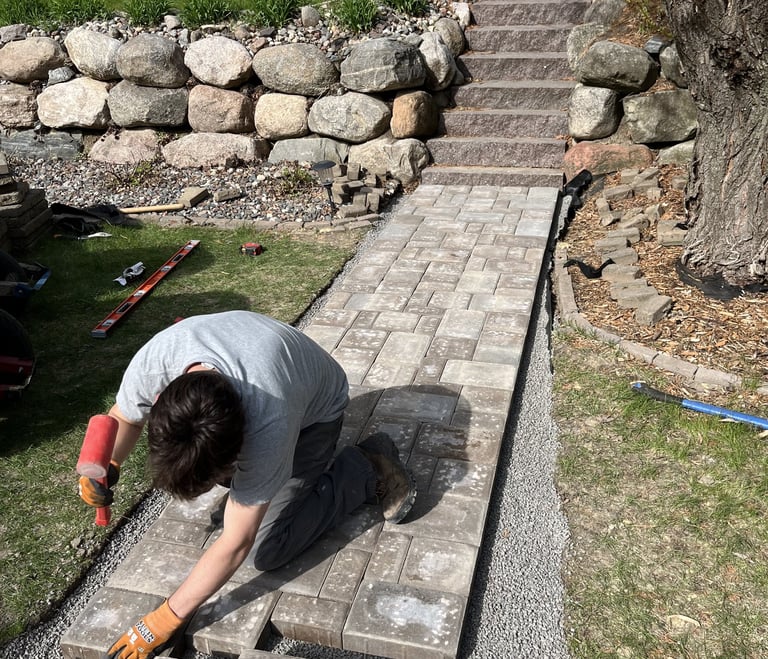 employee-hammering-a-custom-walkway.jpg