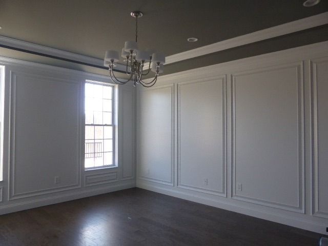 Dining room wall panels, crown molding, and custom architectural trim