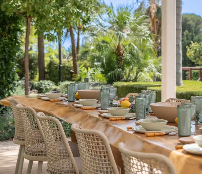 Al fresco dining terrace with wicker chairs at Villa Serenity